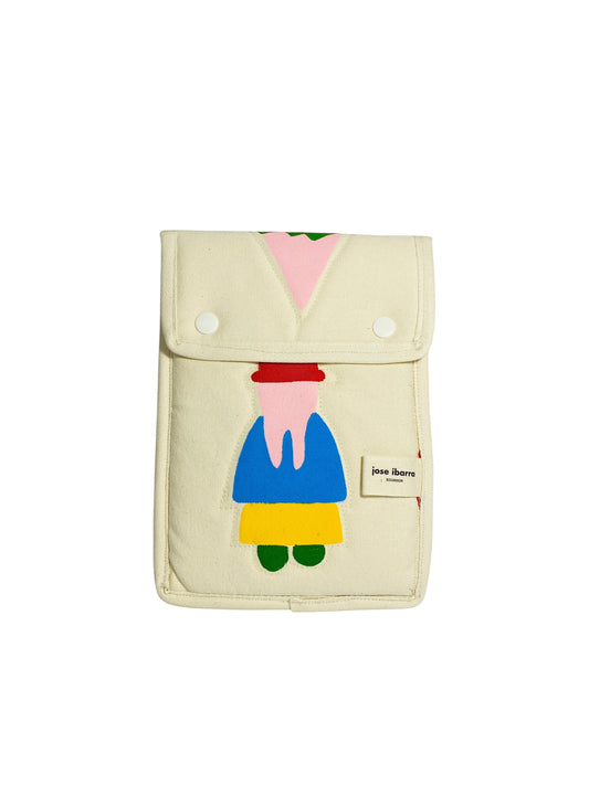 Jose Ibarra Estudio cream cotton iPad sleeve with hand-painted abstract figure in blue, yellow, red, and pink.