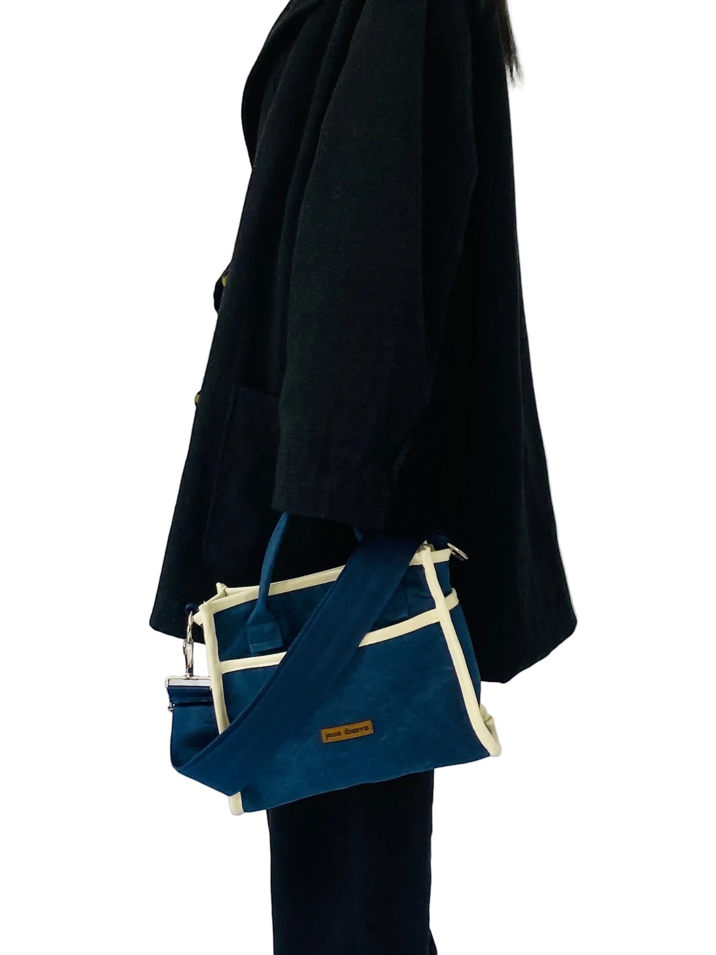 Jose Ibarra Estudio navy blue thick canvas tote bag with cream trim and adjustable strap, includes small pouch.