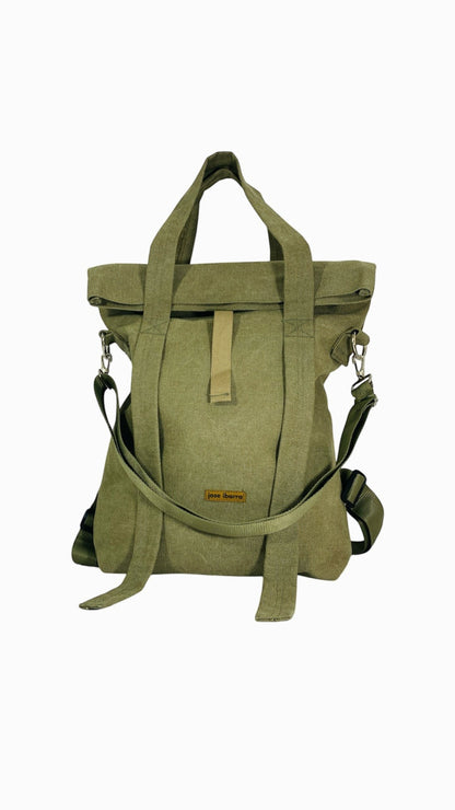 Jose Ibarra olive green canvas multi-use tote bag, backpack, or crossbody bag with adjustable straps and hand-painted design.