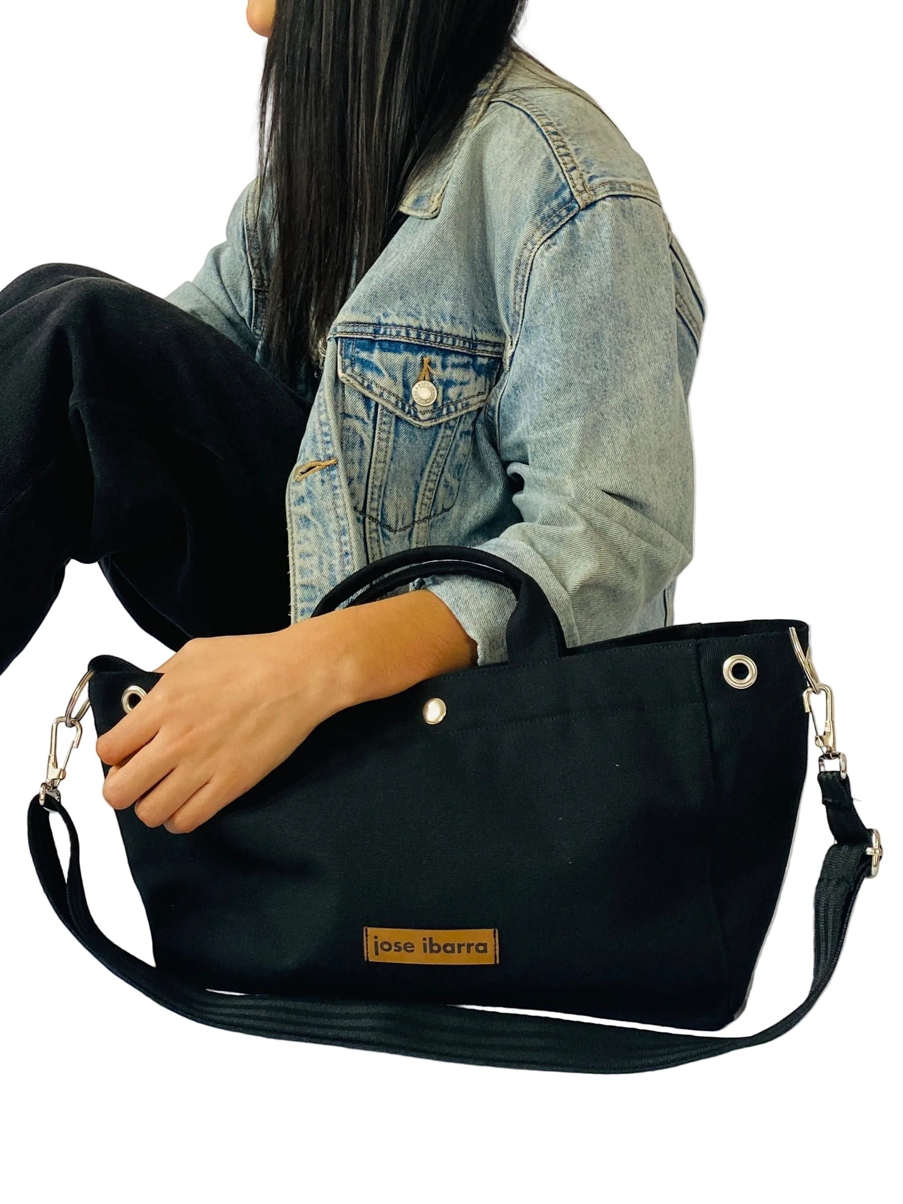 Jose Ibarra Estudio black canvas tote bag with adjustable strap and leather logo patch. Medium size.