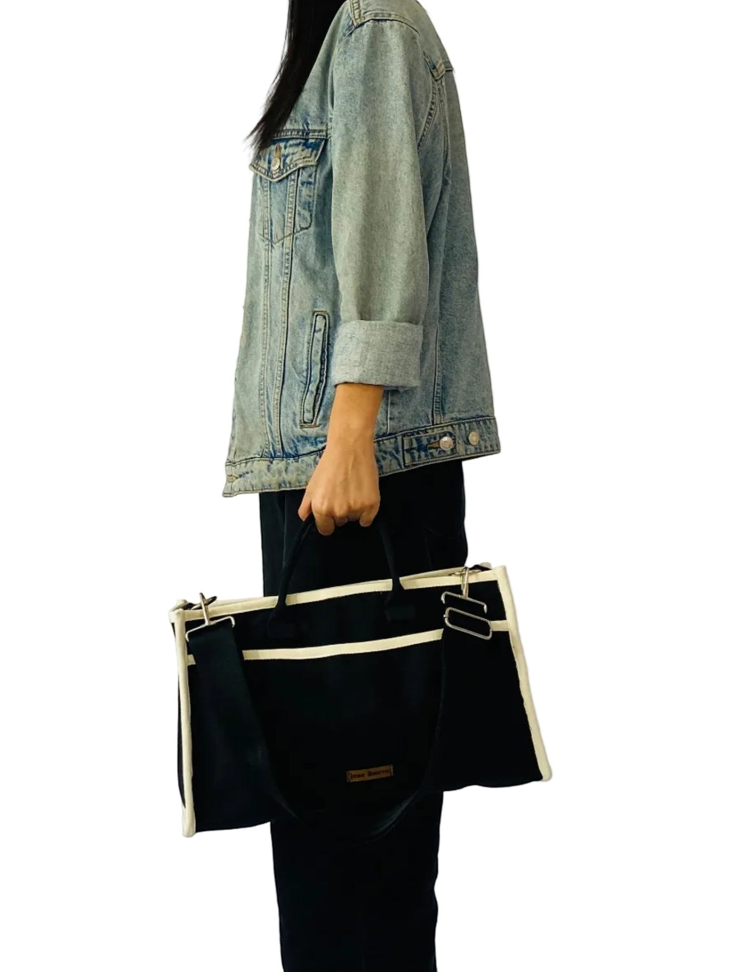 Jose Ibarra Estudio black thick canvas tote bag with cream trim and adjustable strap, medium size.