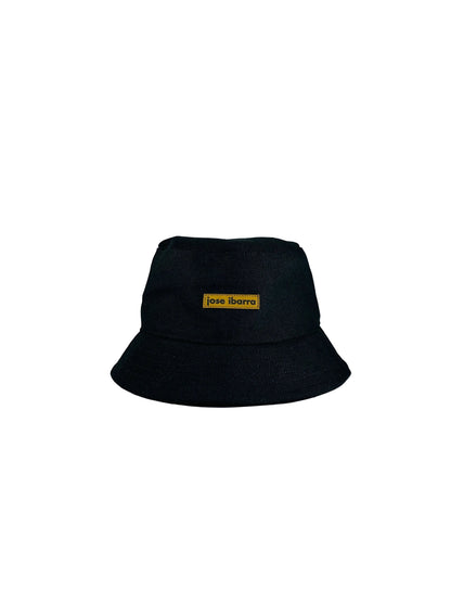 Jose Ibarra Estudio black cotton bucket hat with hand-painted detail and internal cotton lining.