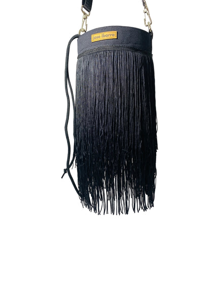 Jose Ibarra Estudio black cotton bucket bag with long fringe detail and adjustable strap.