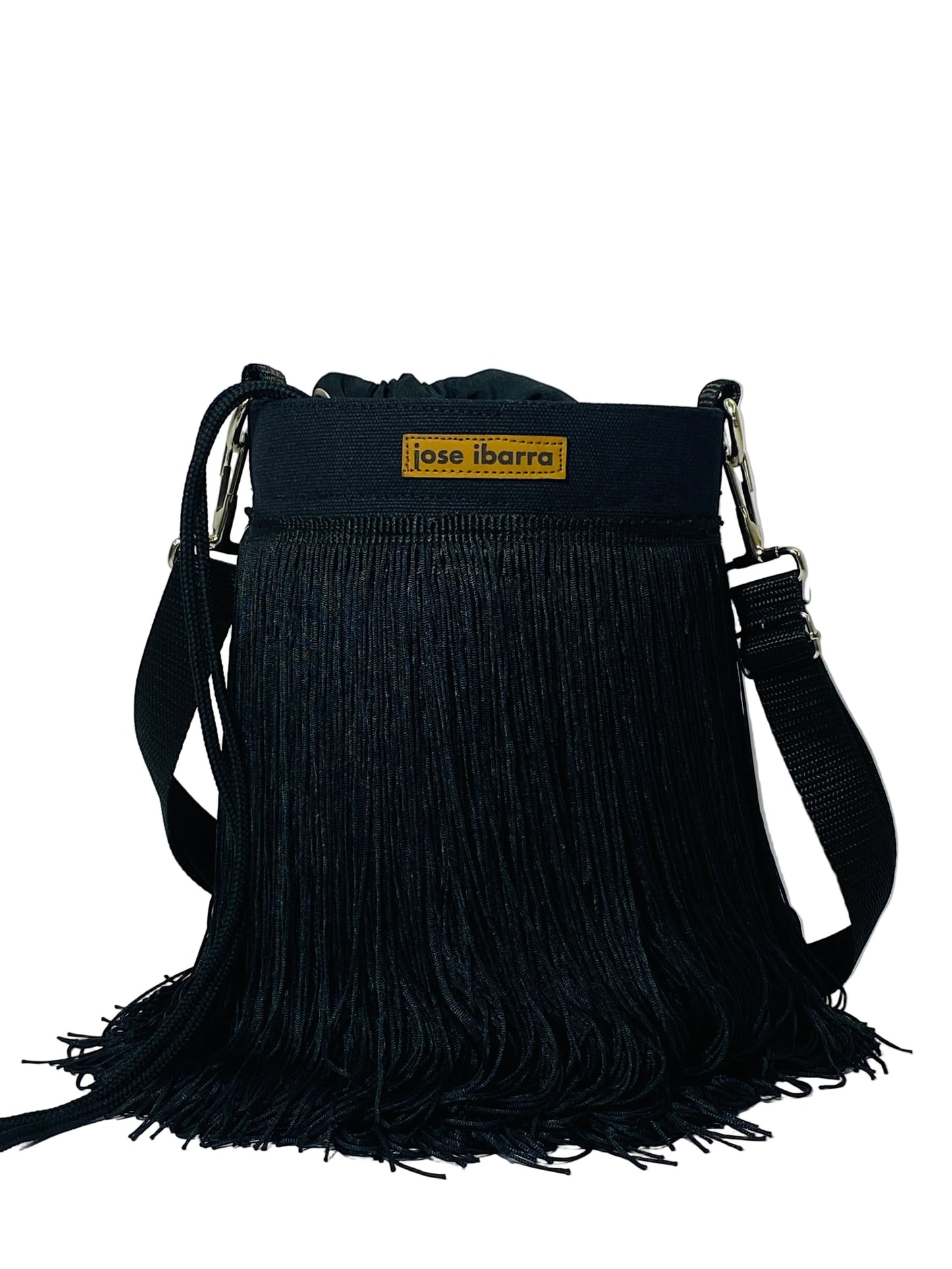 Jose Ibarra Estudio black cotton bucket bag with hand-painted art and traditional fringe detail. Adjustable strap.