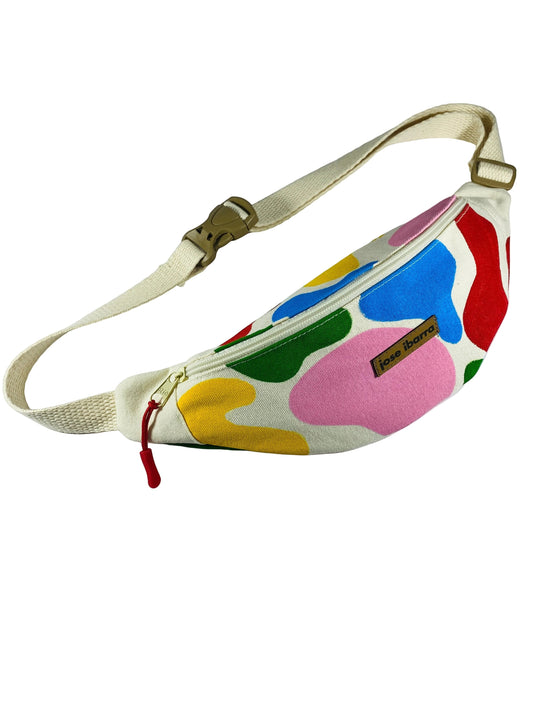 Jose Ibarra Estudio cream canvas fanny pack with abstract colorful shapes in red, blue, yellow, green, and pink. Hand-painted design.