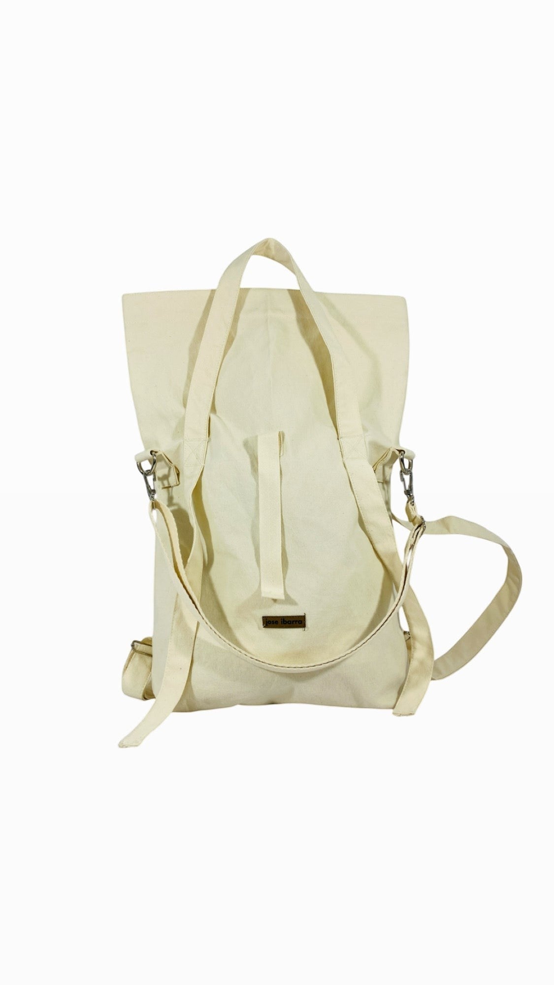 Jose Ibarra Estudio natural canvas multi-use bag, convertible to backpack, tote, or crossbody. Hand-painted art.