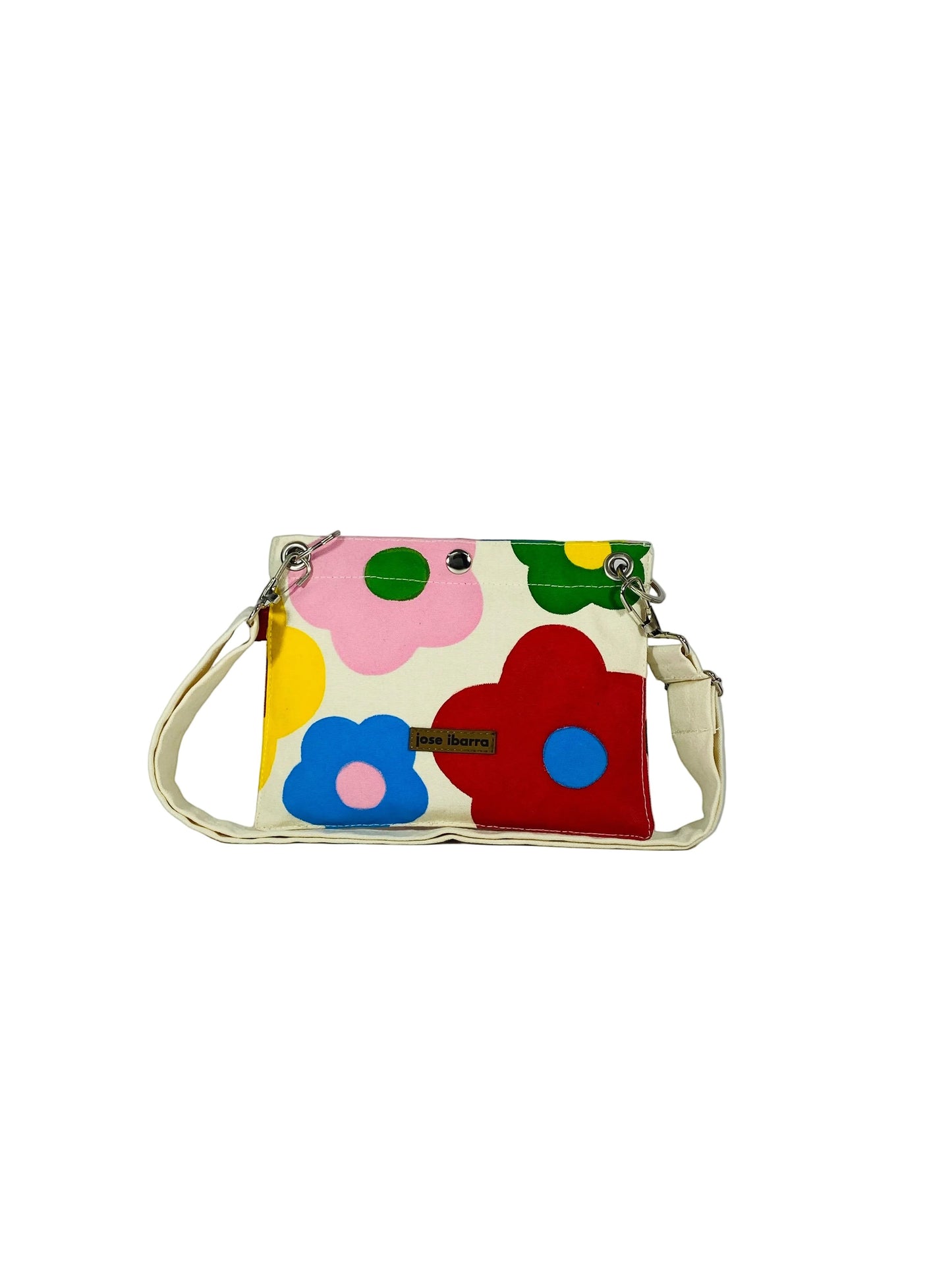 Jose Ibarra Studio cream canvas pouch with hand-painted colorful flowers and a detachable strap.