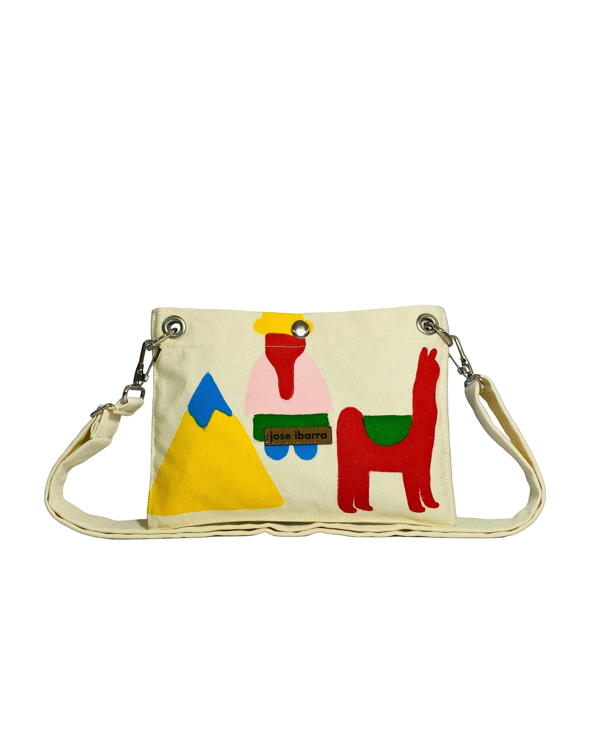 Jose Ibarra Estudio cream cotton canvas pouch with hand-painted folk art design of a mountain, figure, and llama. Includes strap.