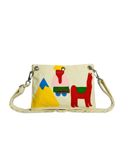 Jose Ibarra Estudio cream cotton canvas pouch with hand-painted folk art design of a mountain, figure, and llama. Includes strap.