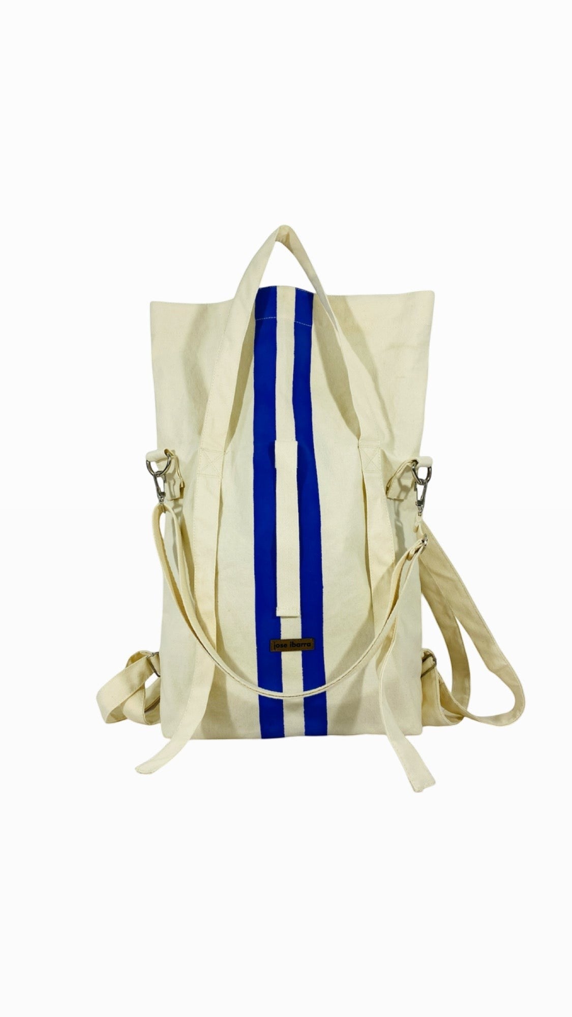 Jose Ibarra Estudio cream canvas tote backpack with blue stripes, convertible straps, 60x40cm