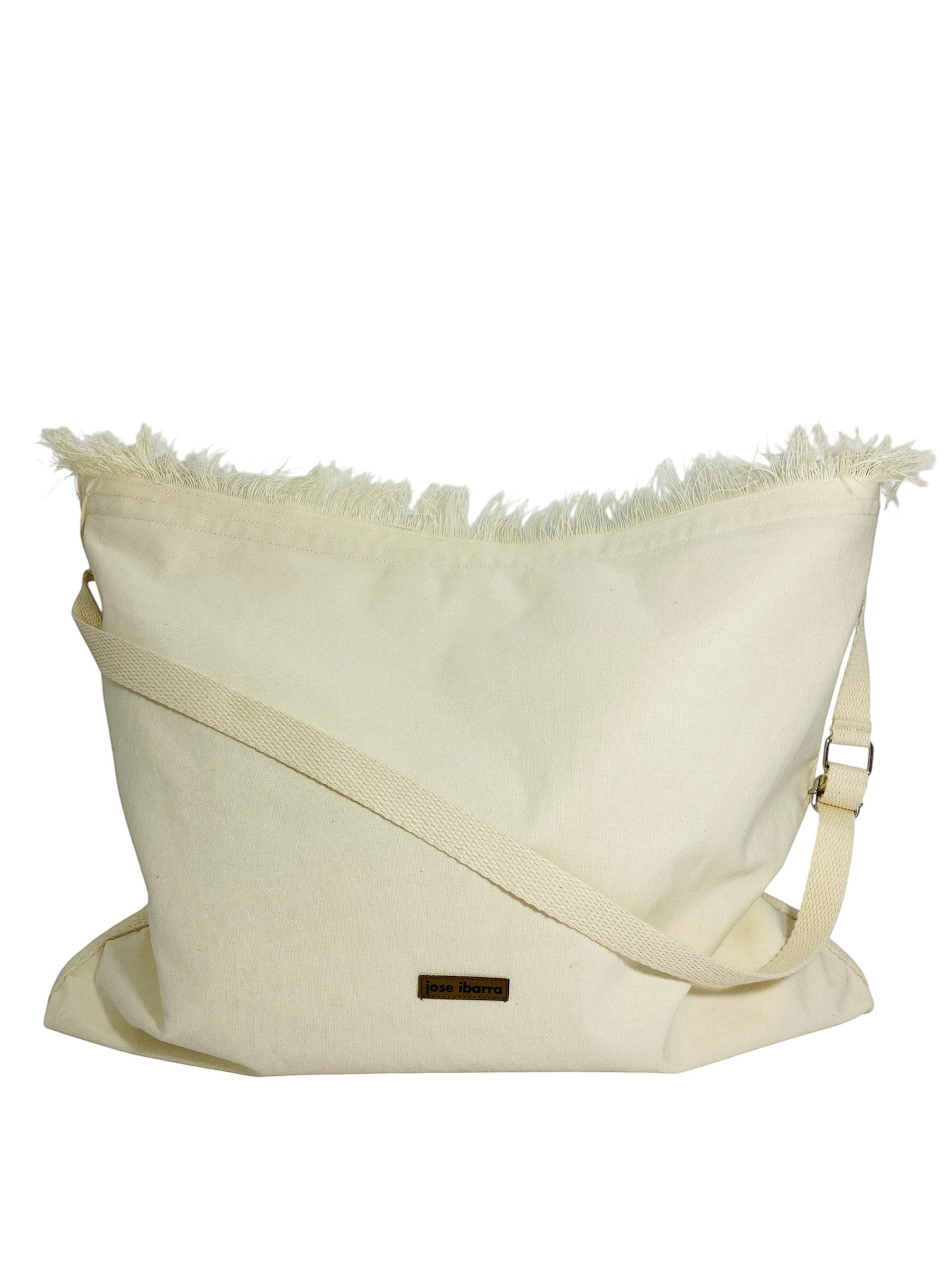 Jose Ibarra Estudio natural canvas tote bag with hand-painted art and frayed edges. Adjustable strap, 60x40cm.