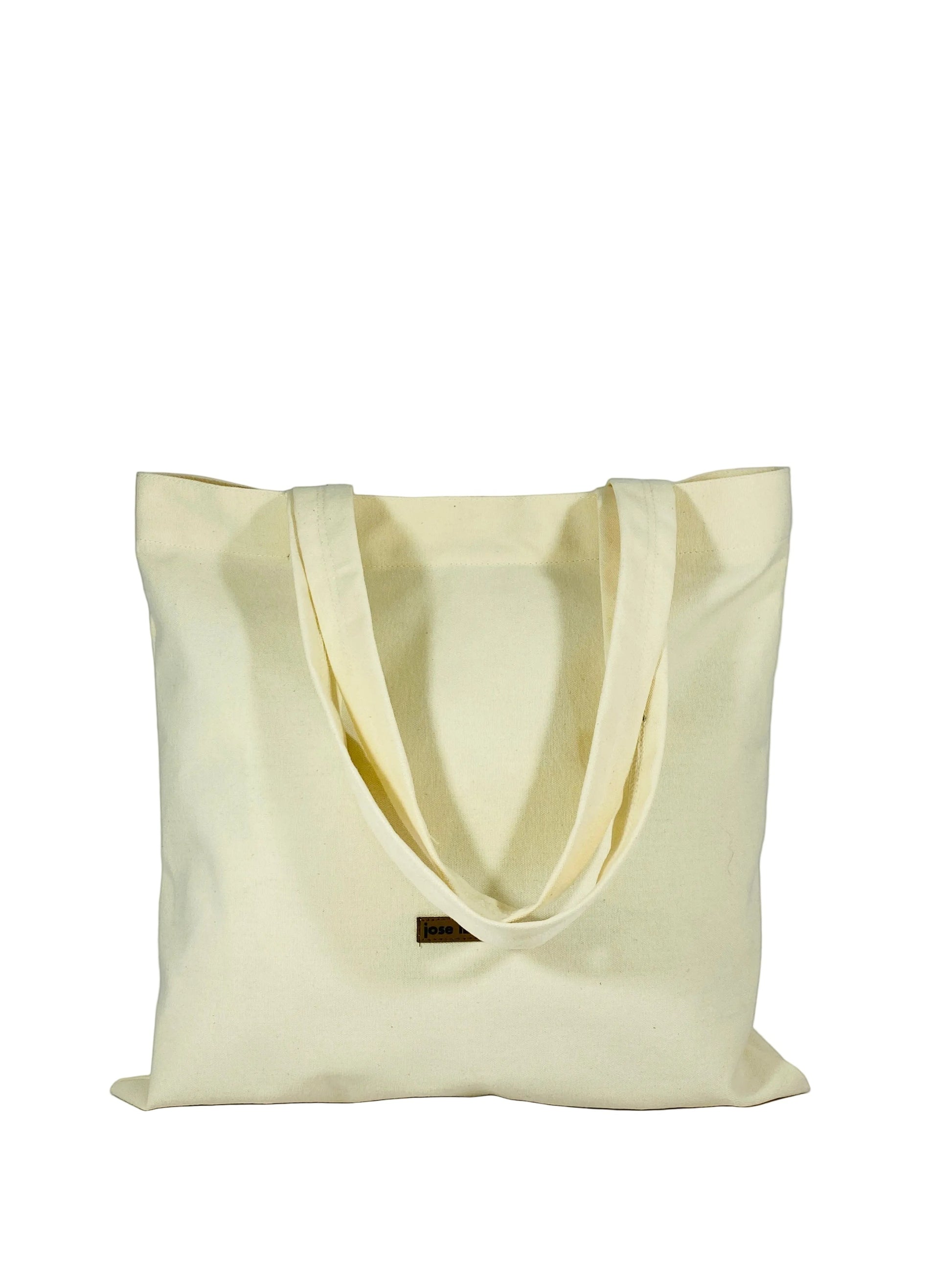 Jose Ibarra Estudio natural canvas tote bag, hand-painted with an internal pocket. Unique artisanal design.