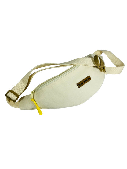 Jose Ibarra Estudio cream canvas fanny pack with yellow zipper and adjustable strap. Hand-painted design.