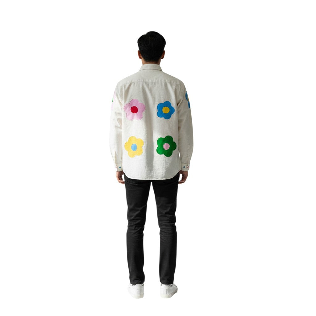 Jose Ibarra Estudio cream 100% cotton canvas shirt with hand-painted colorful flower appliques on back and sleeves.
