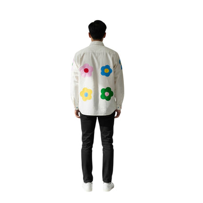 Jose Ibarra Estudio cream 100% cotton canvas shirt with hand-painted colorful flower appliques on back and sleeves.