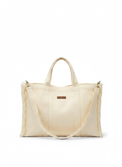 Jose Ibarra Estudio cream canvas tote bag with frayed edges and hand-painted details, includes strap.