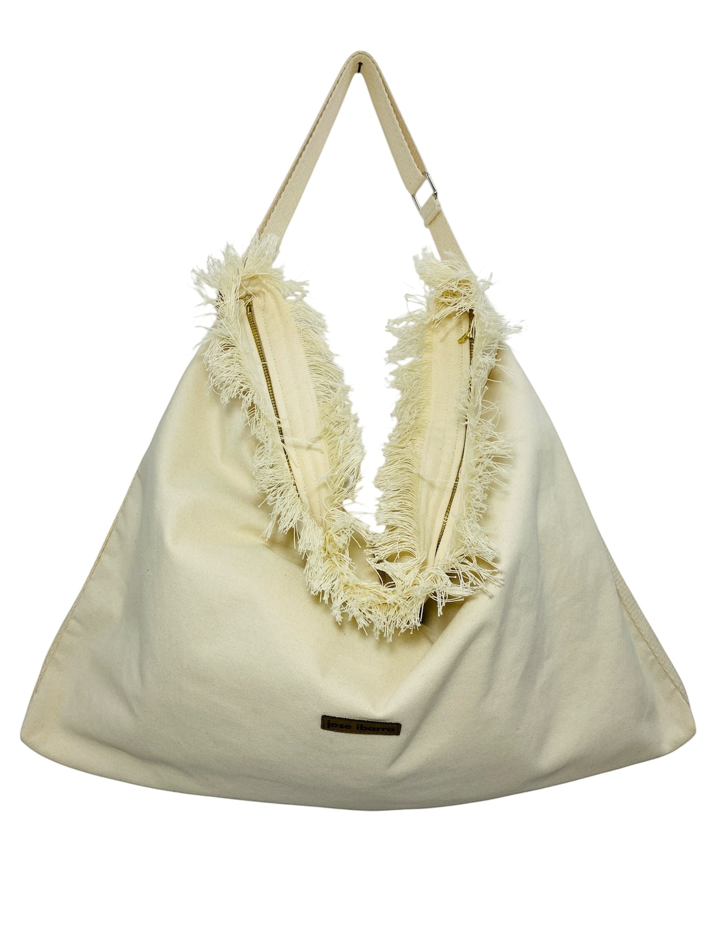Jose Ibarra Estudio cream cotton canvas tote bag with frayed edges and adjustable strap, hand-painted design.