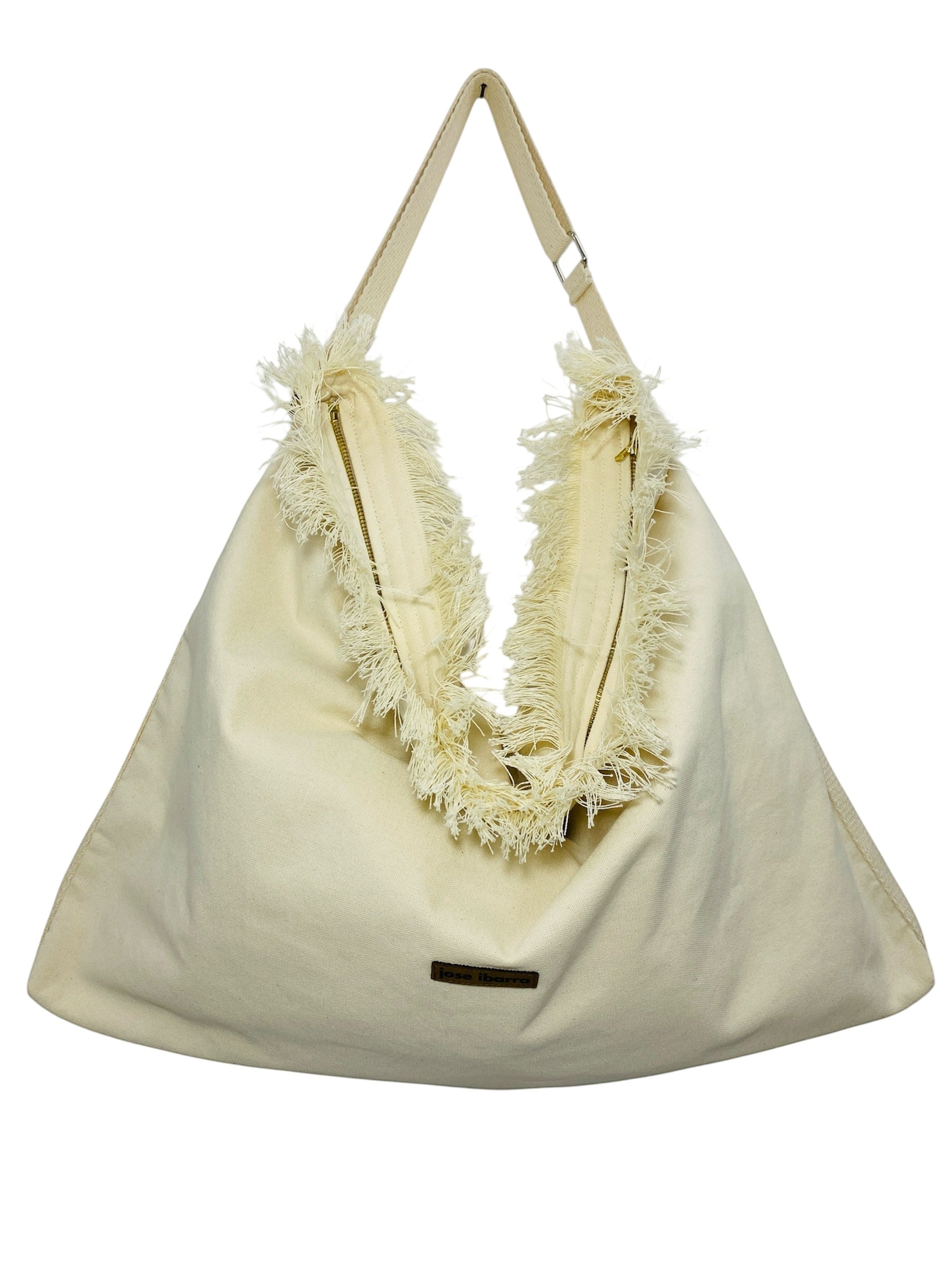 Jose Ibarra Estudio cream cotton canvas tote bag with frayed edges and adjustable strap, hand-painted design.