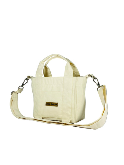 Jose Ibarra Estudio cream canvas tote bag, hand-painted, with internal pockets and strap. 18x16x9 cm.
