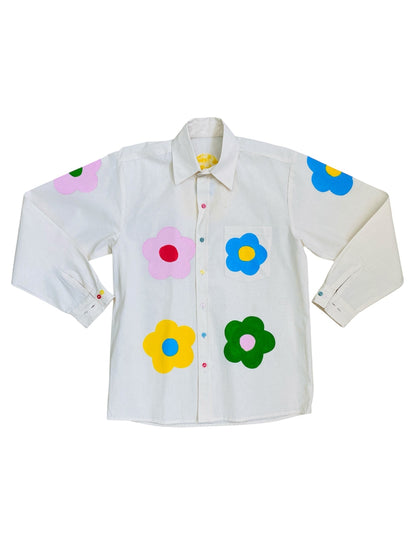 Jose Ibarra Estudio cream 100% cotton loose-fit shirt with hand-painted colourful flowers and button details.