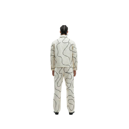 Jose Ibarra Estudio cream cotton jacket with black abstract line art, unisex, hand-painted design.