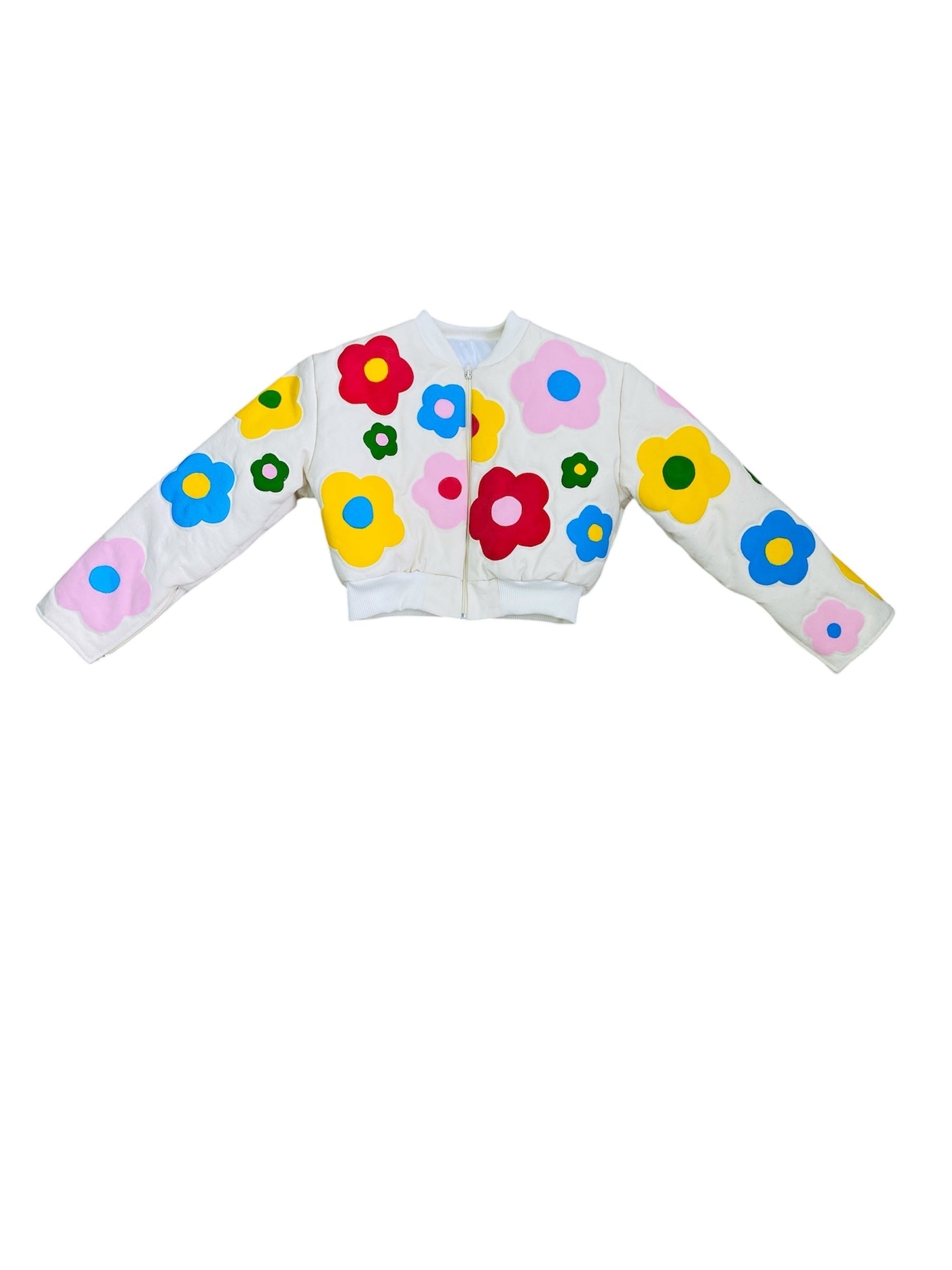Jose Ibarra Estudio cream bomber jacket with colorful floral appliques, 100% cotton canvas, hand-painted design.