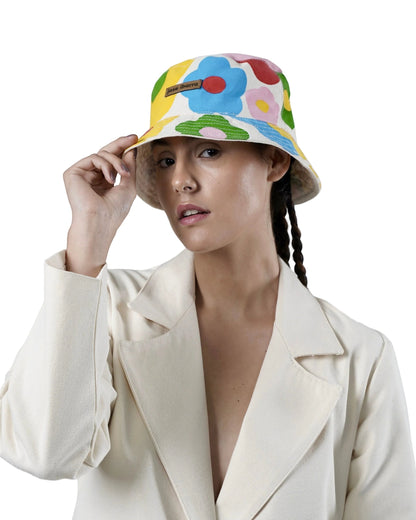 Jose Ibarra Estudio white cotton bucket hat with hand-painted colorful floral pattern and internal cotton lining.