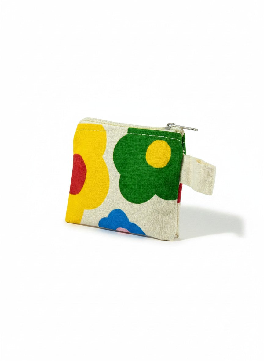 Jose Ibarra Estudio cream canvas coin purse with hand-painted abstract floral design in yellow, red, green, blue, and pink. Zipper closure and loop handle.