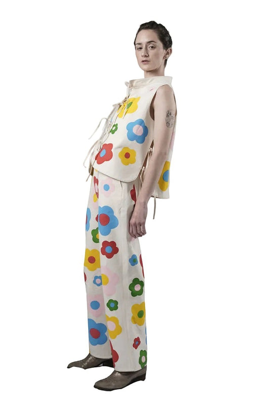 Jose Ibarra Estudio cream canvas vest and pants set with colorful hand-painted floral print. Lace-up sides.