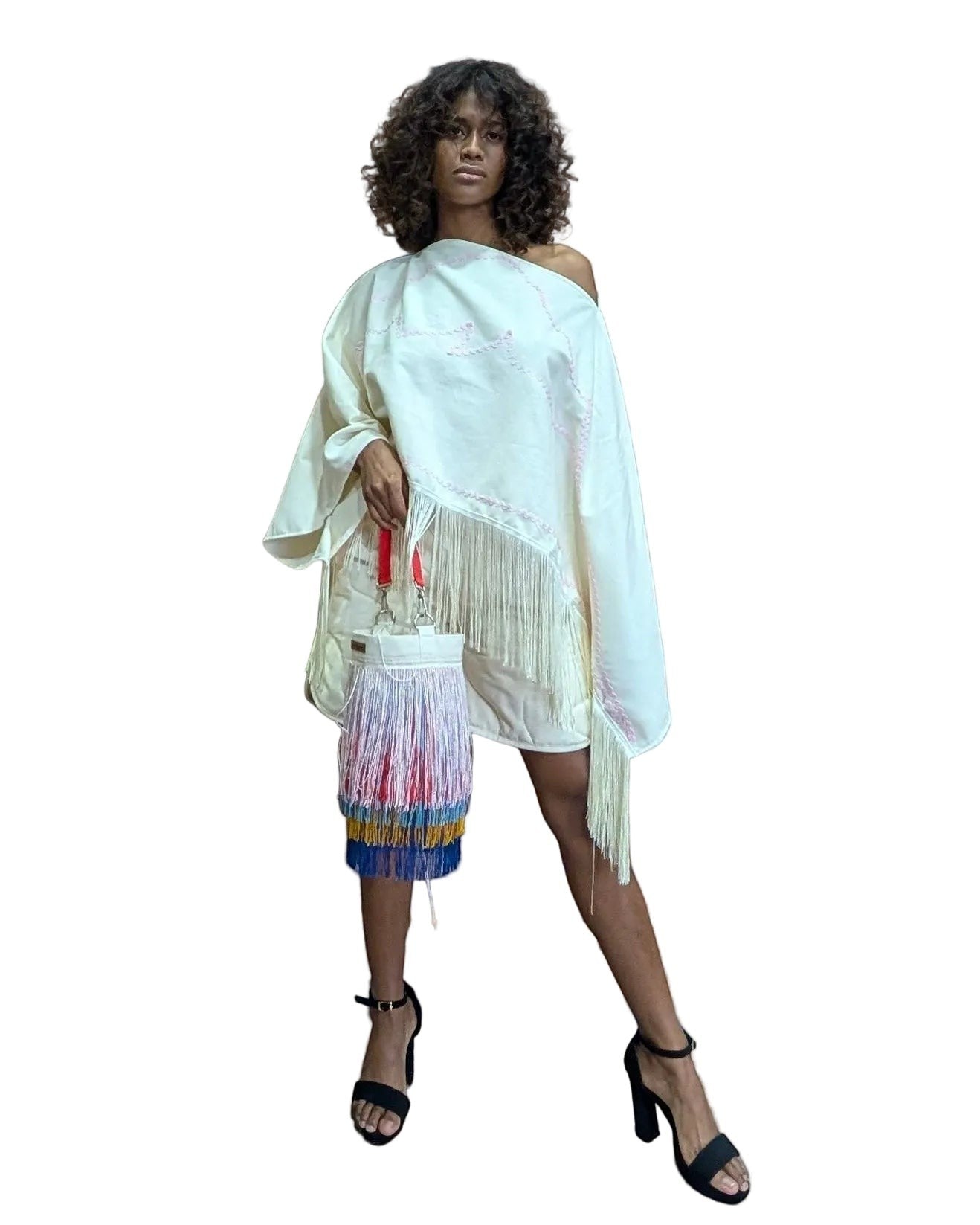 Jose Ibarra Estudio cream cotton bucket bag with multi-colored fringe and traditional tassels, hand-painted design.