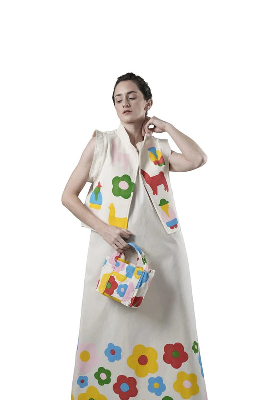 Jose Ibarra Estudio cream 100% cotton canvas vest, hand-painted with colorful folk art motifs like llamas and flowers. Lined with cotton.