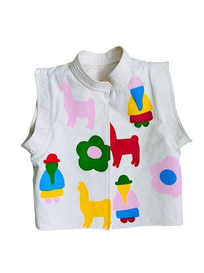 Jose Ibarra Estudio white 100% cotton canvas vest, hand-painted with colorful llamas, flowers, and figures.