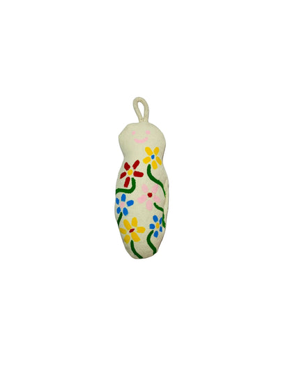 Jose Ibarra Estudio cream cotton keychain with hand-painted flowers and a smiley face.