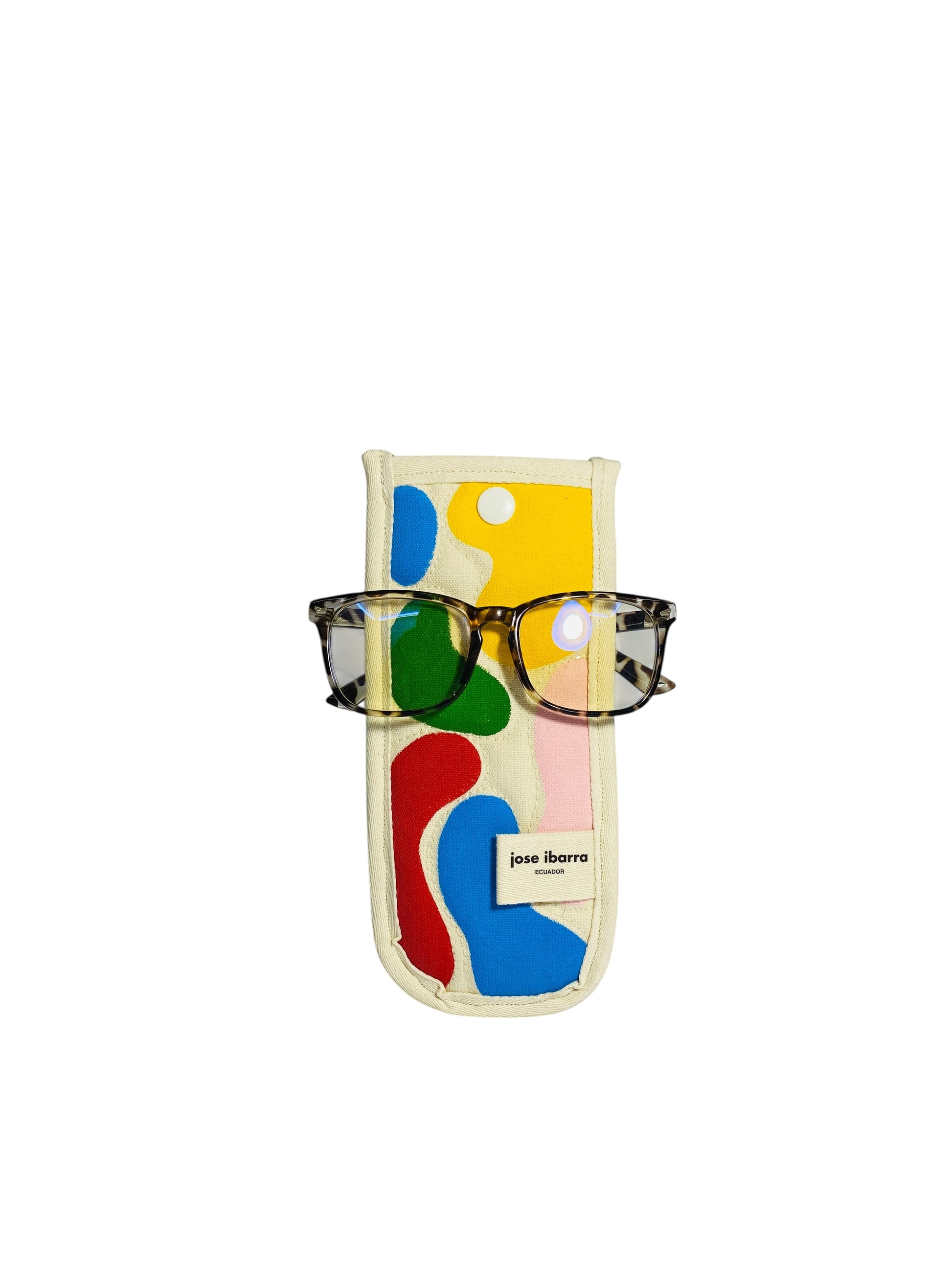 Jose Ibarra Estudio cream cotton glasses case with abstract hand-painted colourful shapes and a white button closure. Includes glasses.