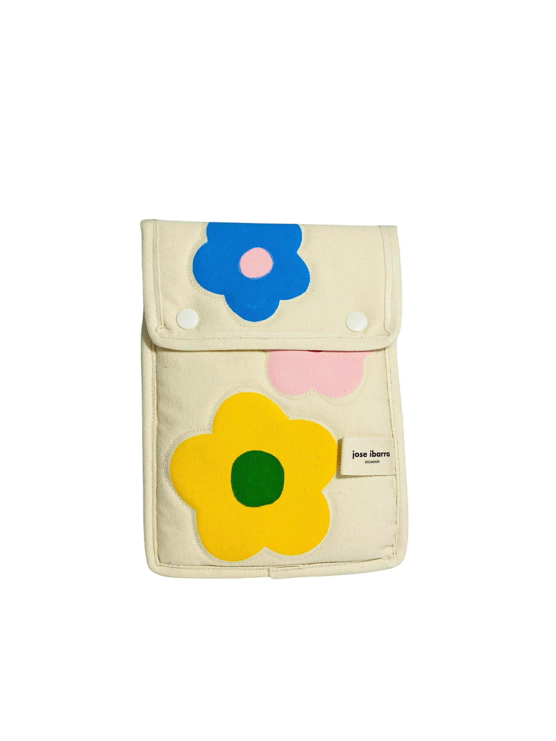Jose Ibarra Estudio cream cotton iPad sleeve with hand-painted floral appliques in blue, yellow, and pink.