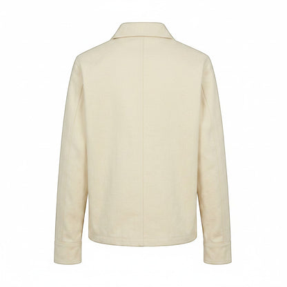 Jose Ibarra Estudio natural canvas unisex jacket made of 100% cotton with cotton lining. Classic collar and long sleeves.