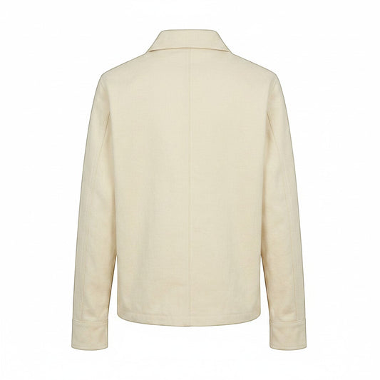 Jose Ibarra Estudio natural canvas unisex jacket made of 100% cotton with cotton lining. Classic collar and long sleeves.