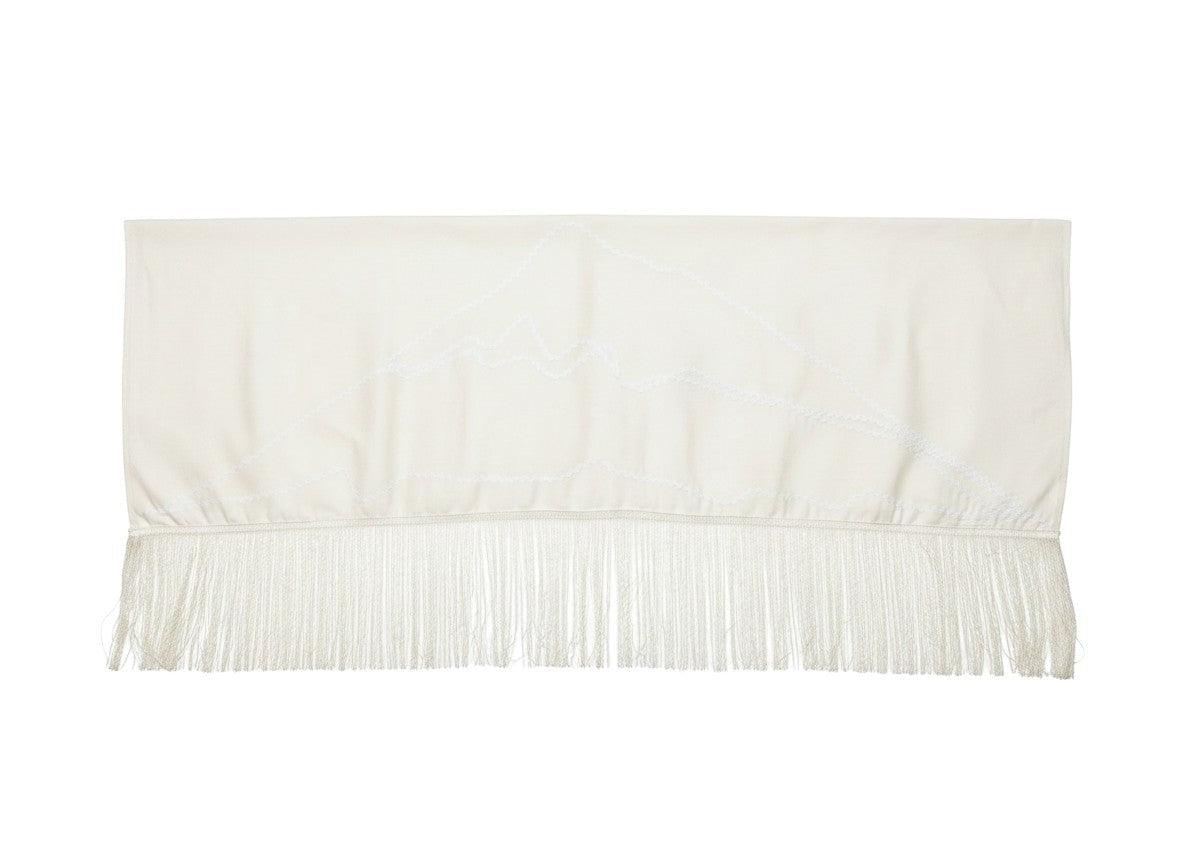 Jose Ibarra Estudio natural cream cotton and wool blend shawl with zigzag trim and fringed hem, embroidered with mountain peaks.