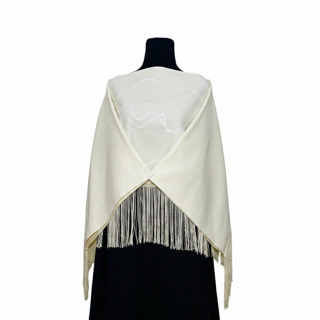 Jose Ibarra Estudio natural cream wool blend shawl with zigzag trim and fringe detail