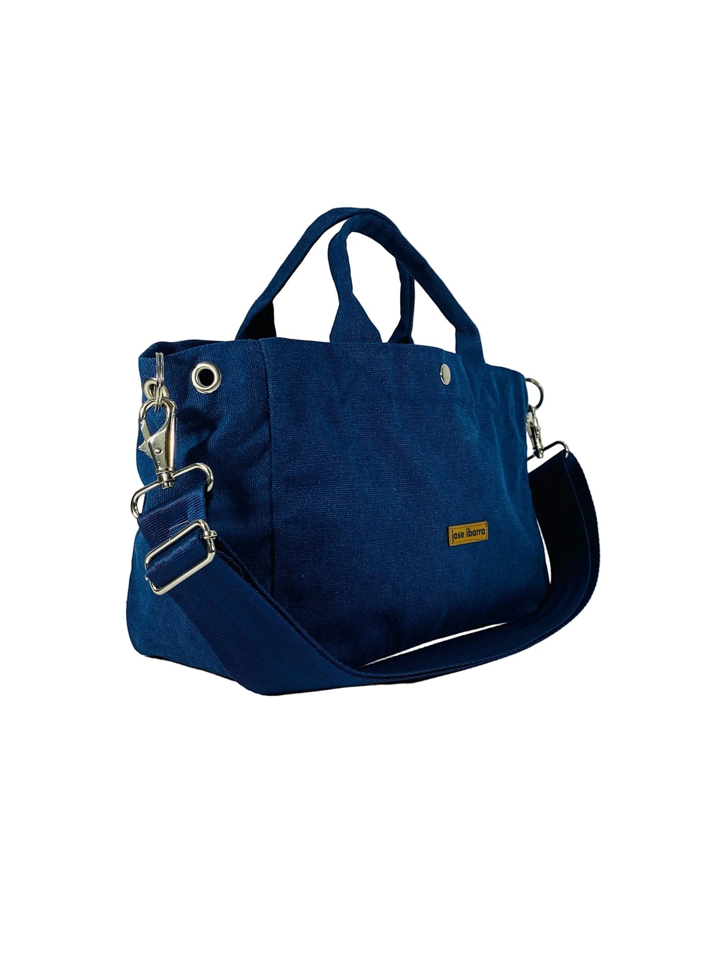 Jose Ibarra Estudio medium navy blue canvas tote bag with adjustable strap and internal pockets.
