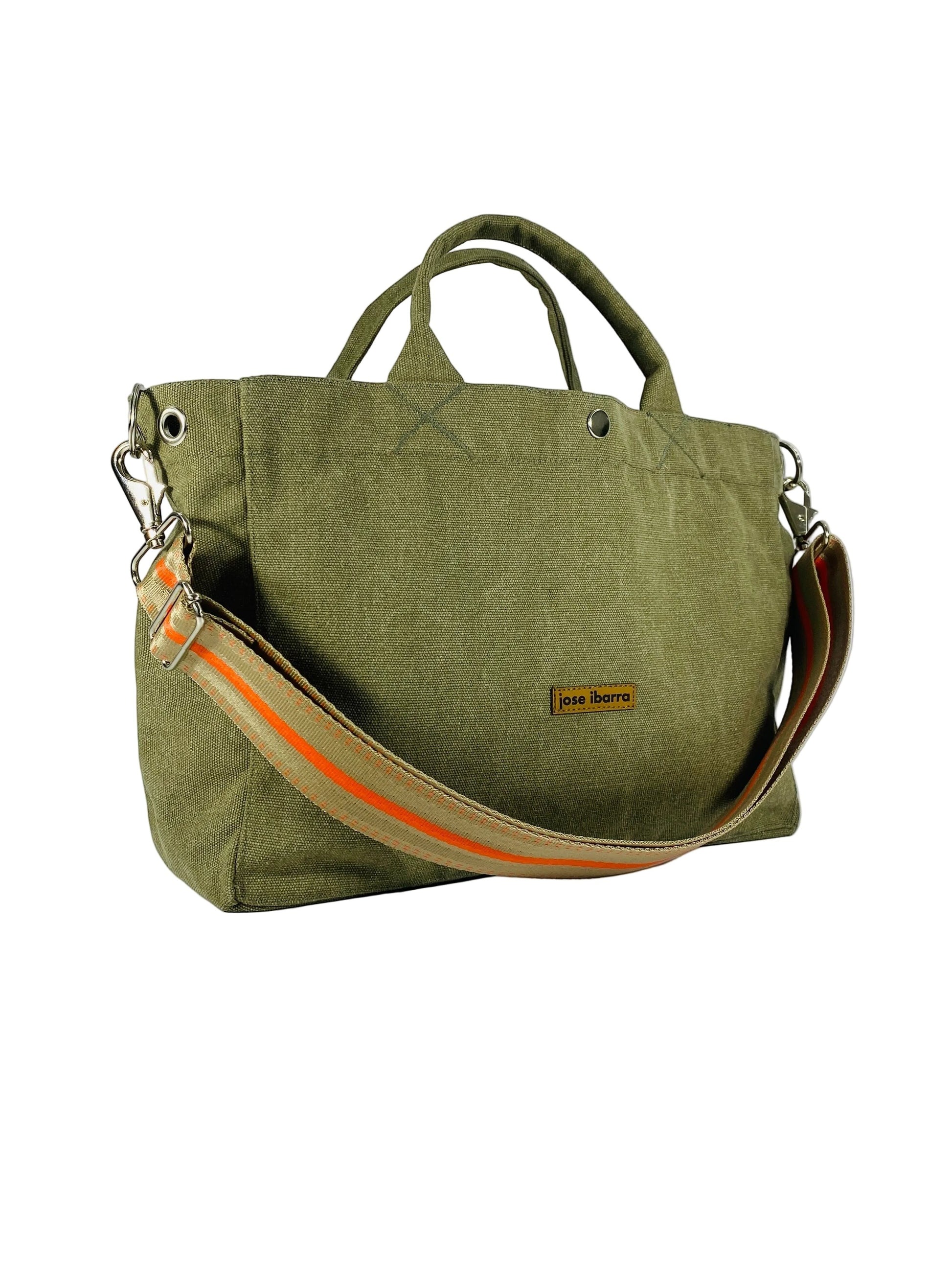 Jose Ibarra Estudio olive green canvas tote bag with orange stripe detail on strap, includes shoulder strap.