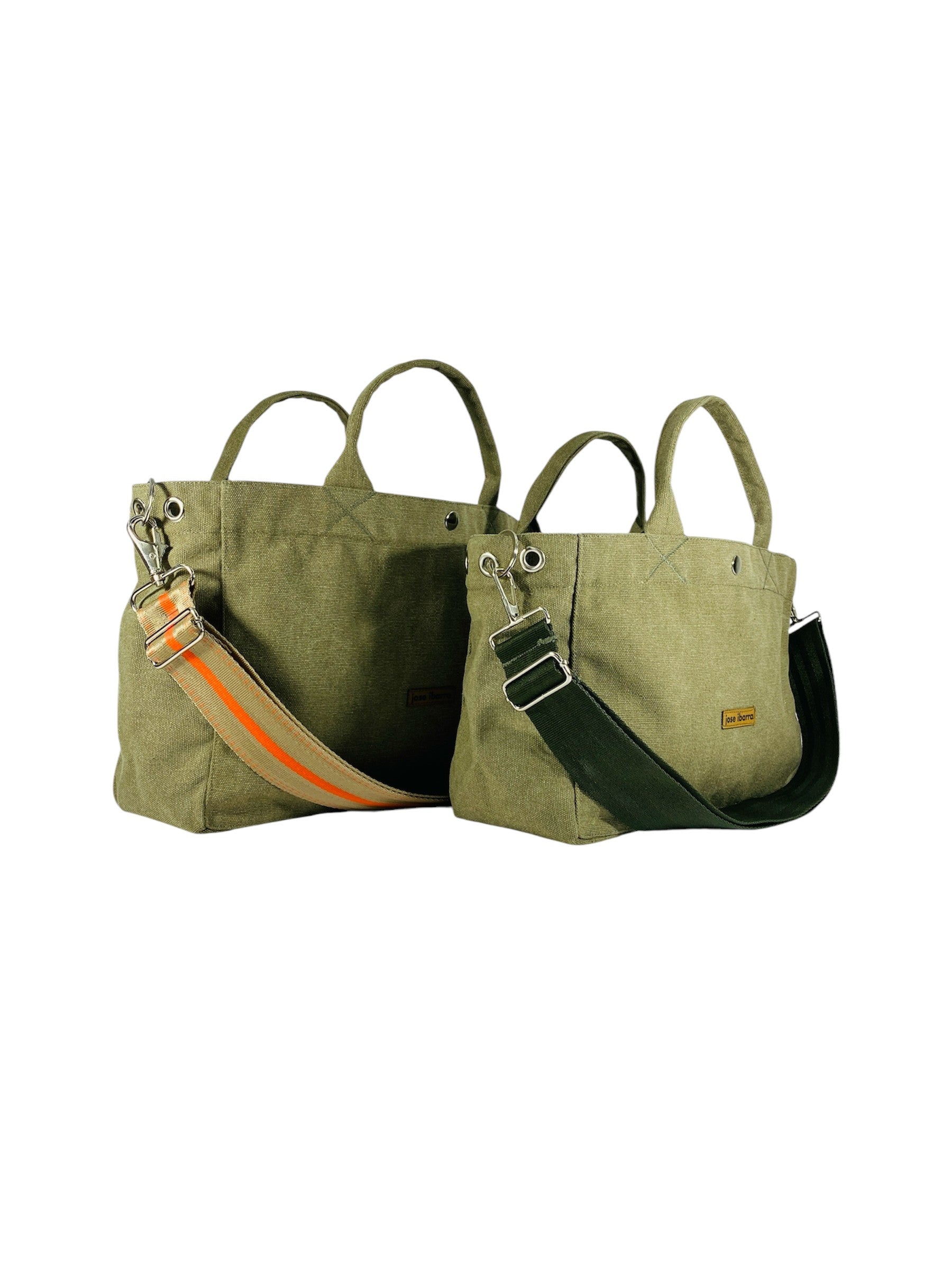 Jose Ibarra Estudio olive green canvas tote bags, medium and large, with adjustable straps and internal pockets. One strap features orange stripes.