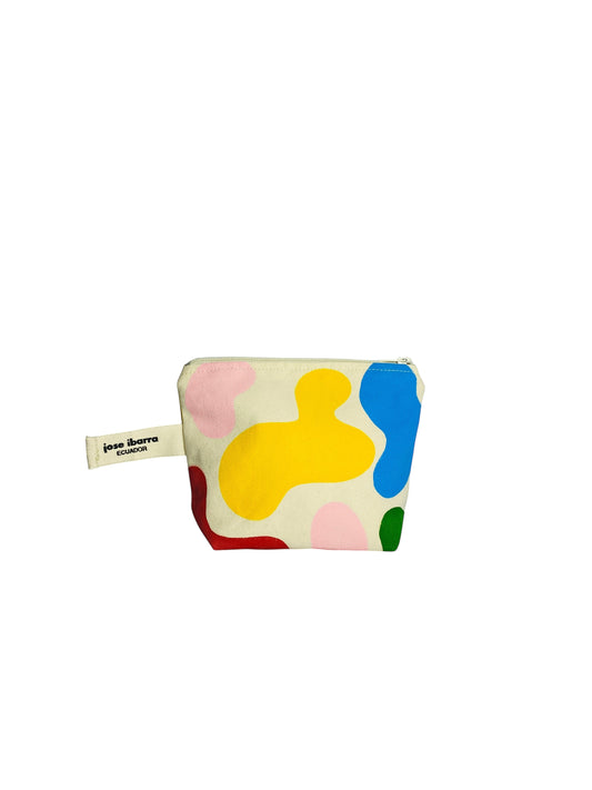 Jose Ibarra Estudio cream canvas cosmetic bag with abstract hand-painted colorful shapes in yellow, pink, blue, red, and green.
